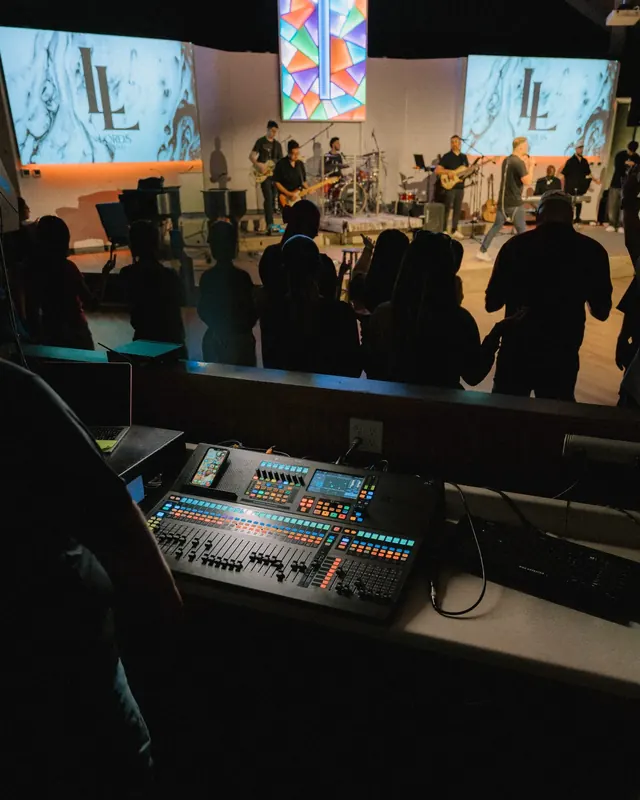Musician using QMix personal monitor control