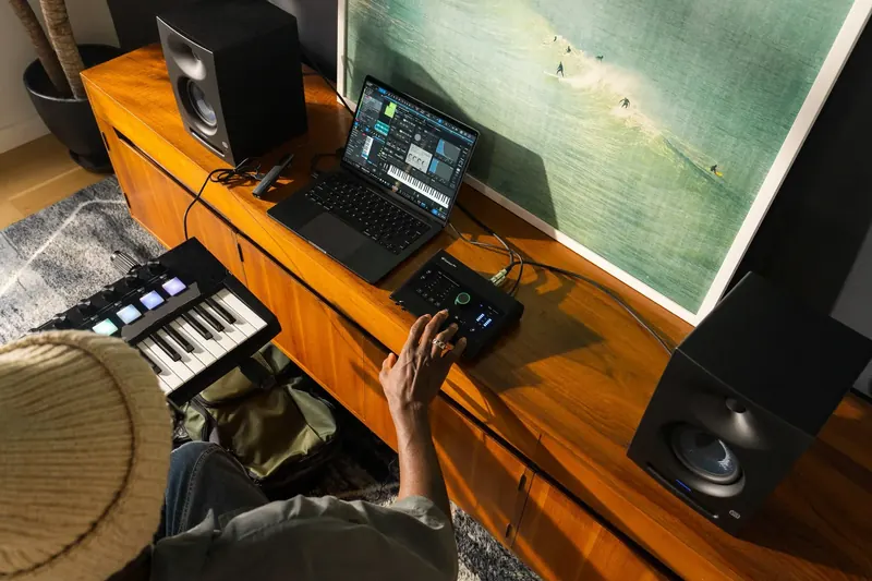 Producer Mad Keys at a keyboard rig in a colourful studio for the PreSonus Quantum launch